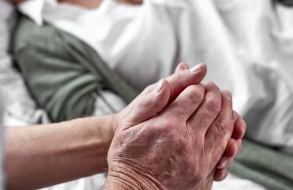 Close up of hands being held